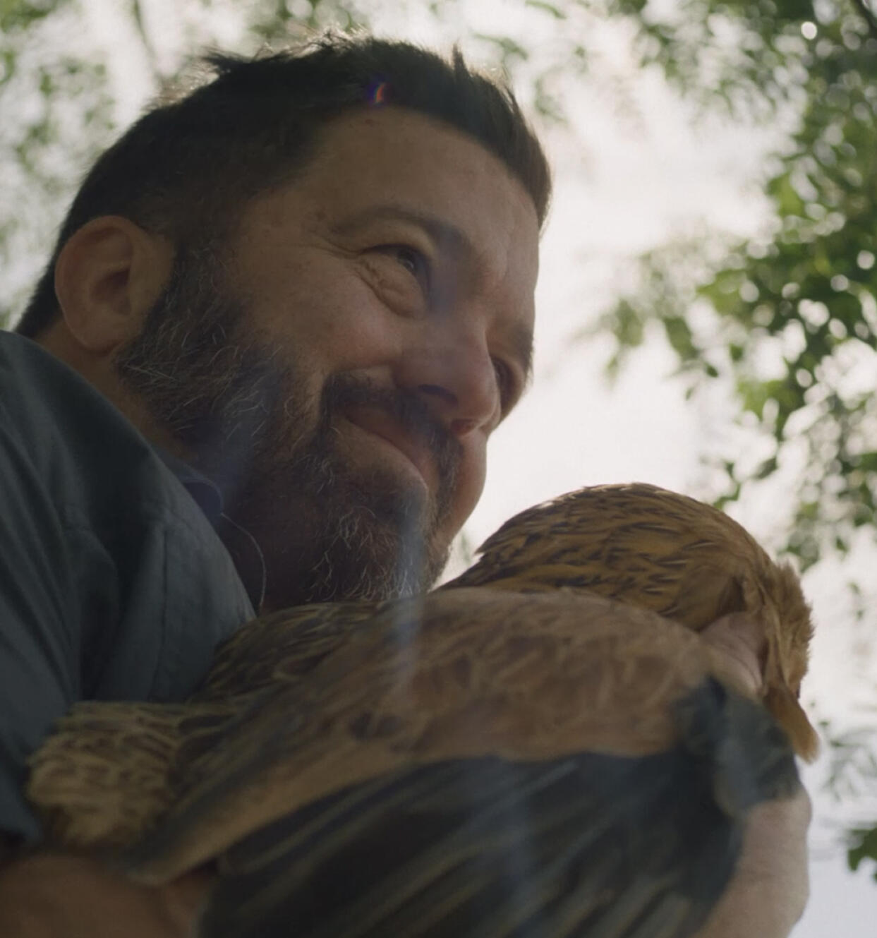 Man holding a chicken