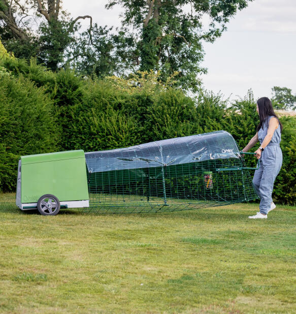 Eglu Go chicken coop being moved easily with wheels and handles